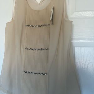 Add a little sparkle to your wardrobe. Never worn.